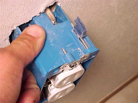 loose outlet box in drywall